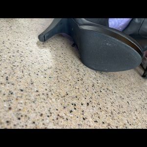 Black wedge knee high boot worn inside only